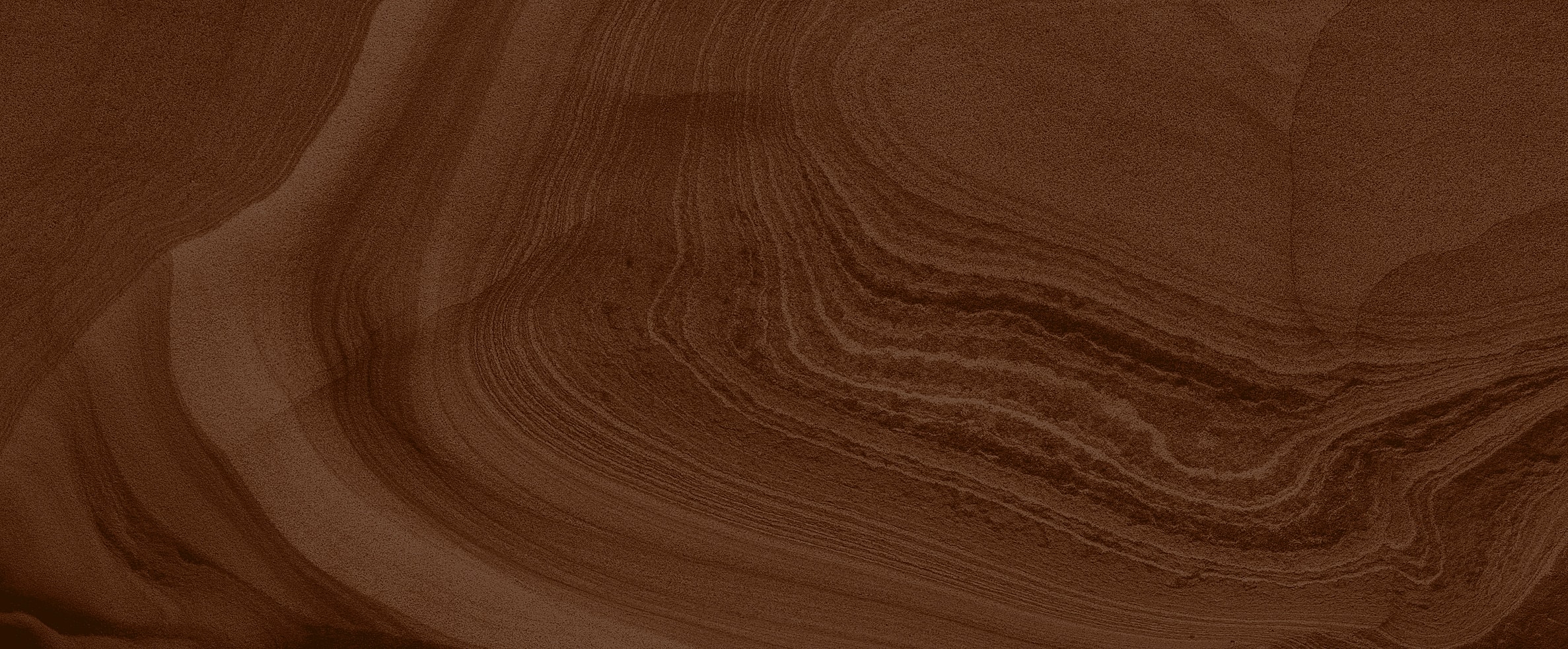 Abstract brown texture with wavy patterns.