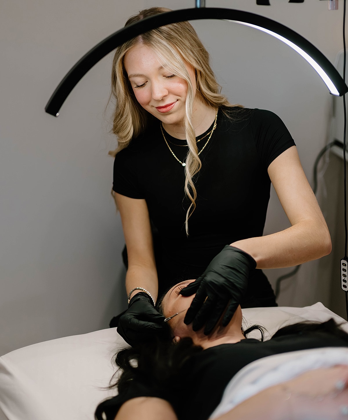 Beauty treatment in progress at a skincare clinic.