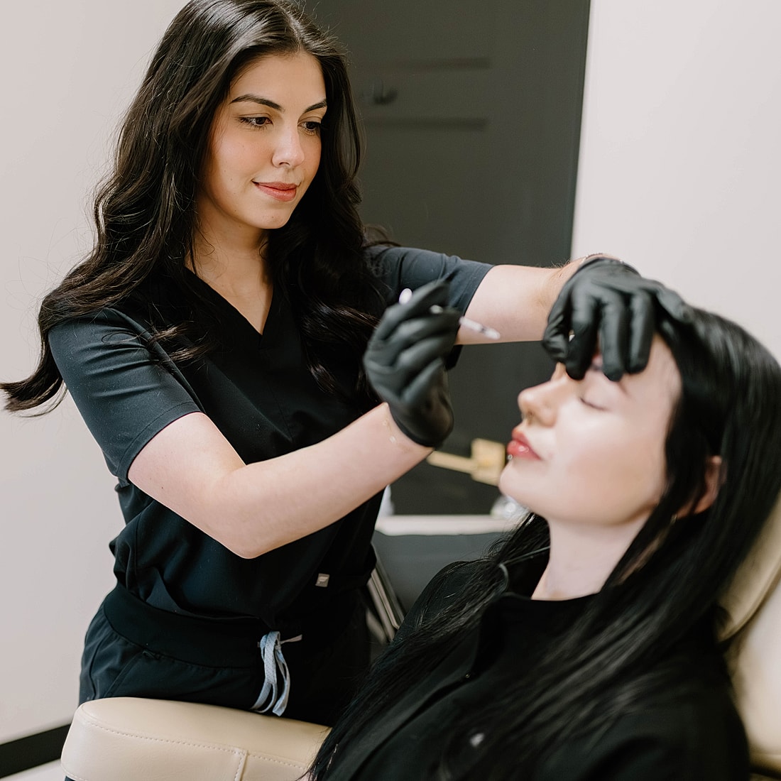 Beauty treatment session in a salon setting.