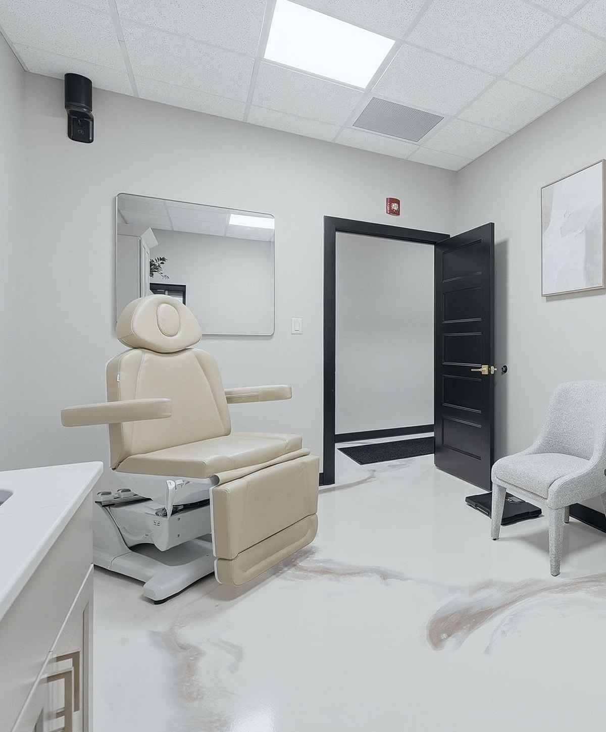 Modern treatment room with adjustable chair.