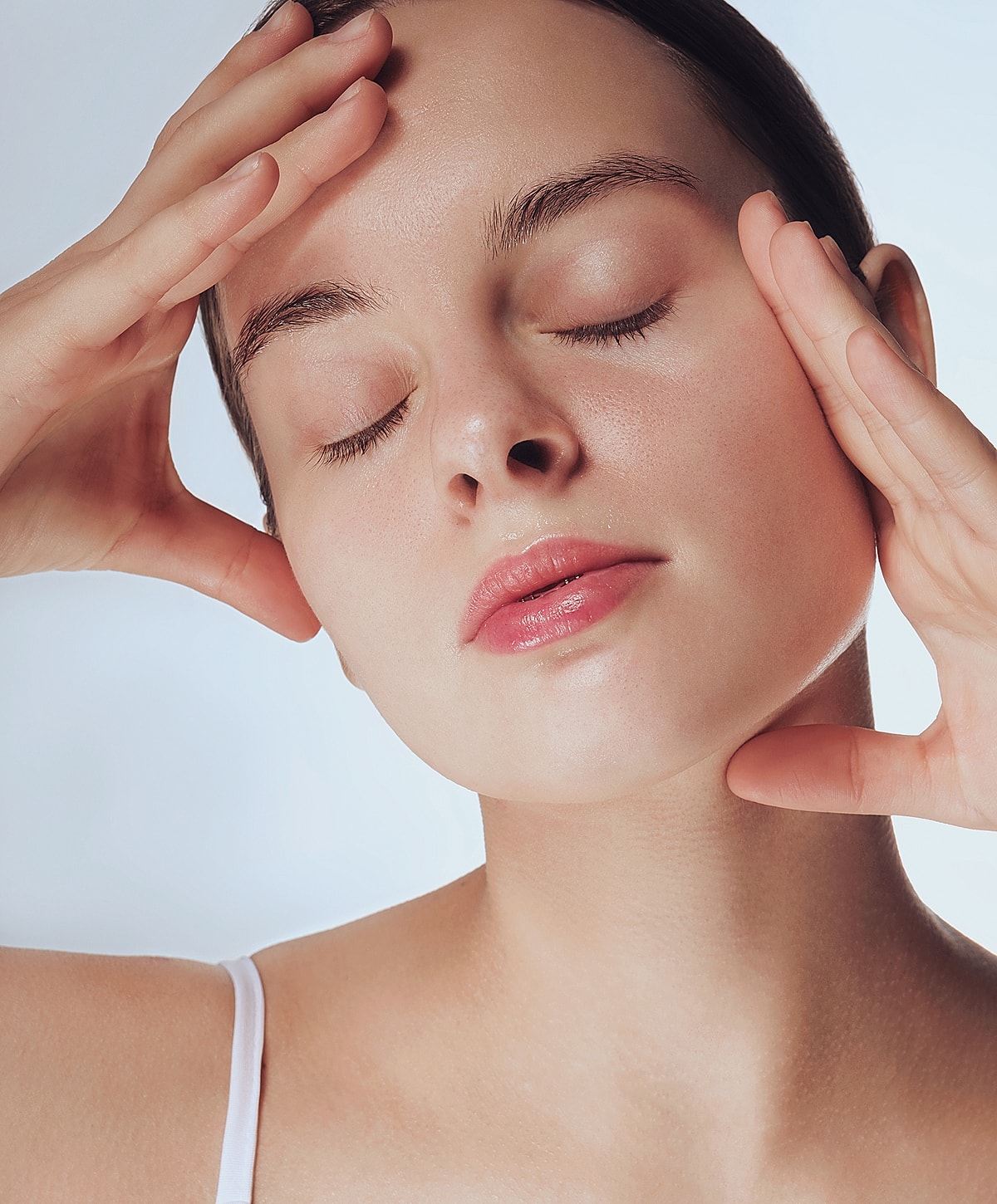 Young woman with closed eyes, serene expression.