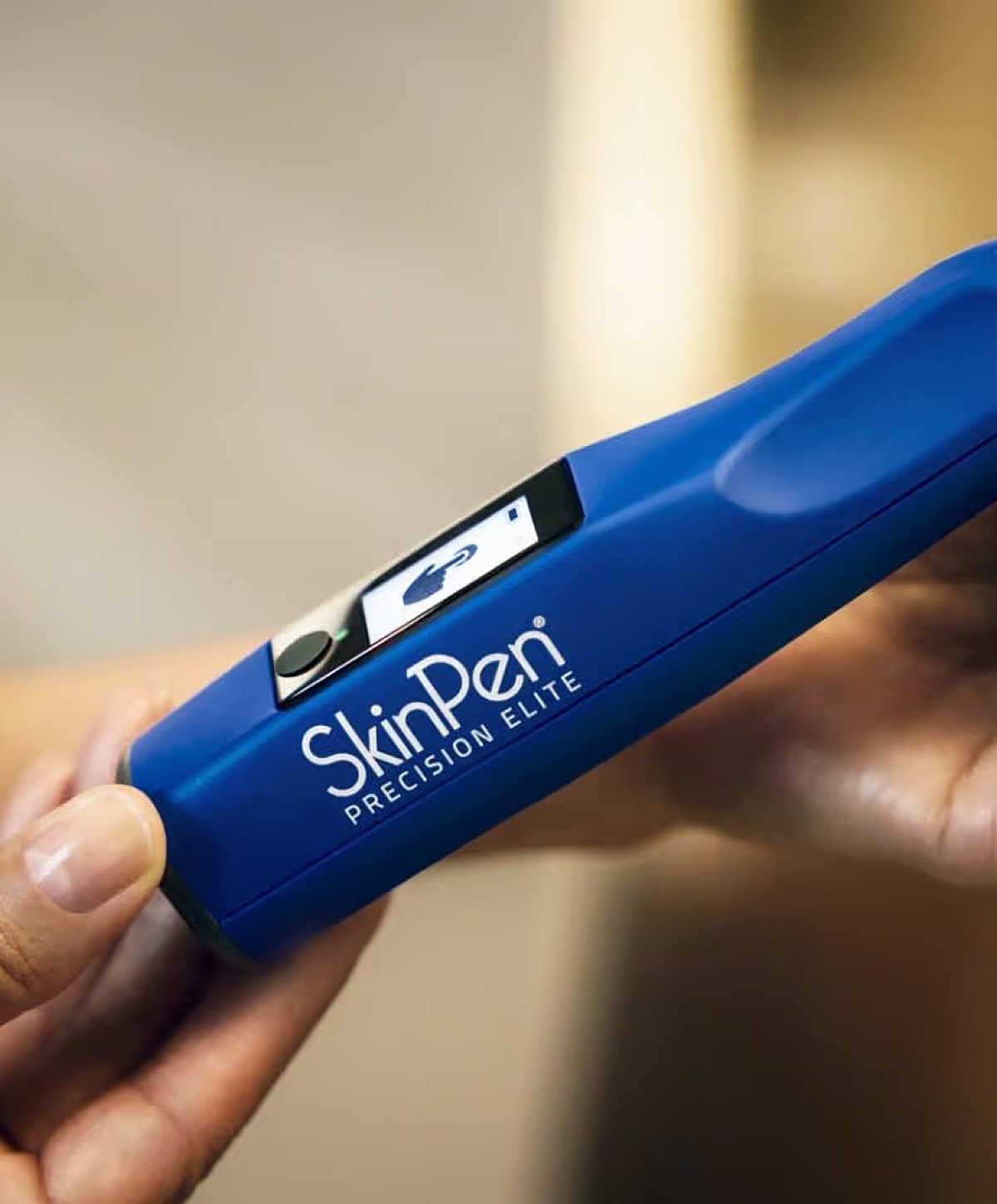 SkinPen Precision Elite microneedling device in hand