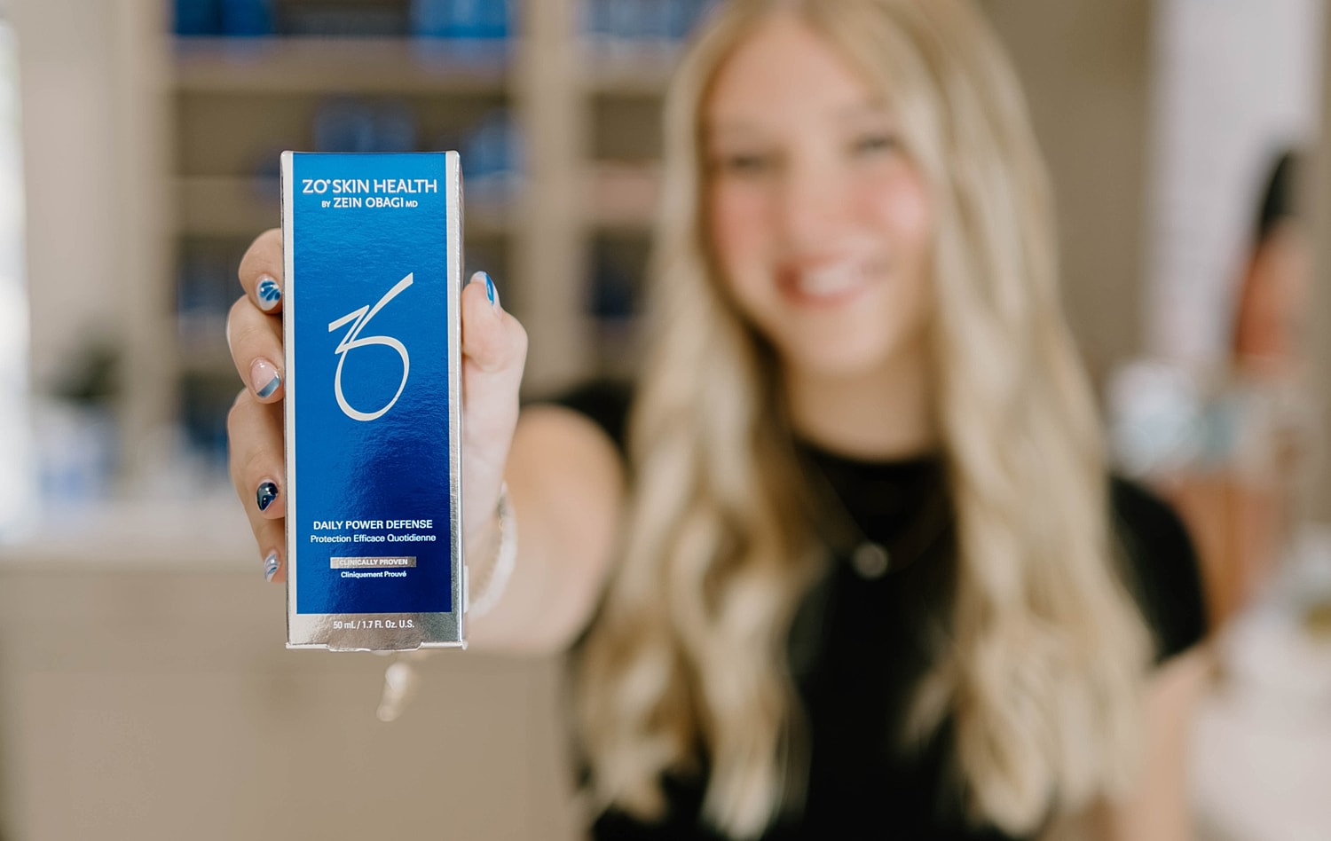 Person holding ZO Skin Health product box.
