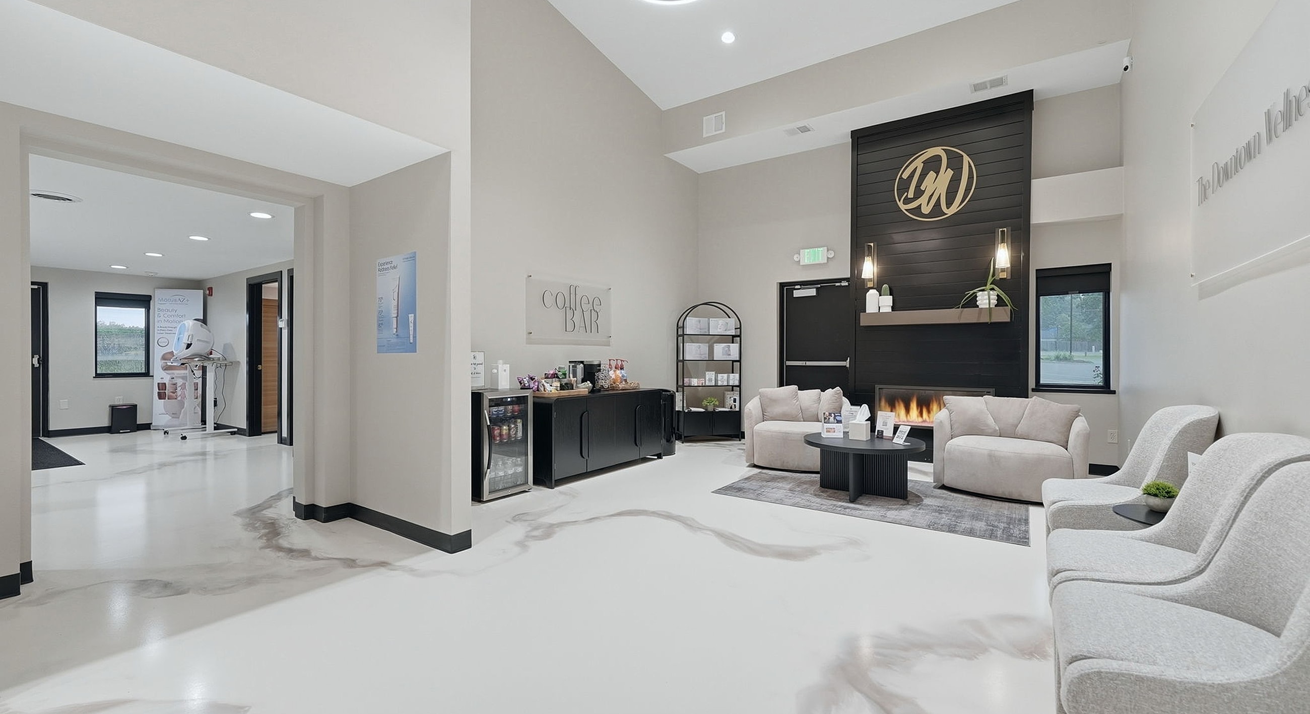 Modern waiting area with coffee bar and seating.