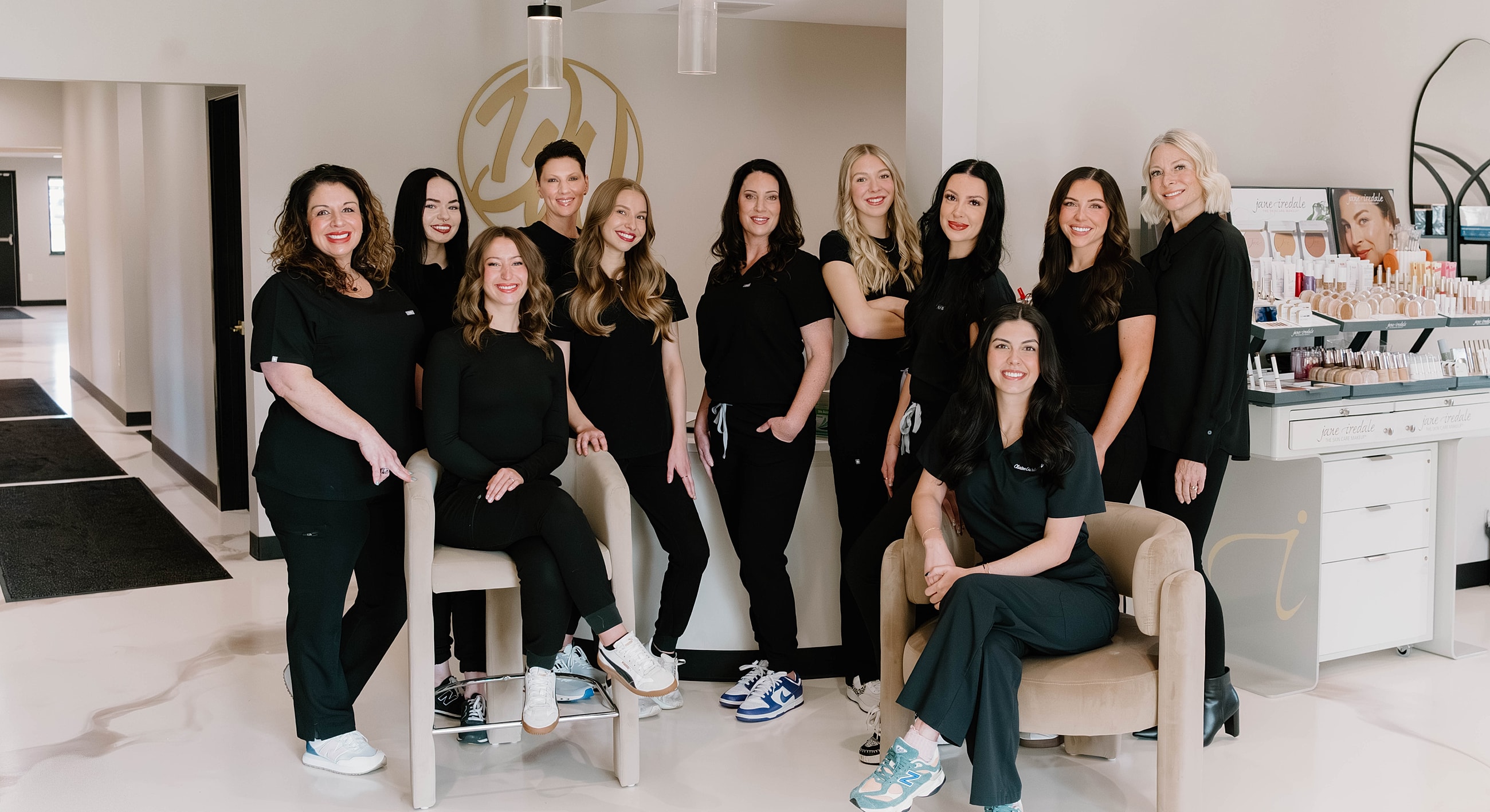 Group photo of beauty professionals in a salon.