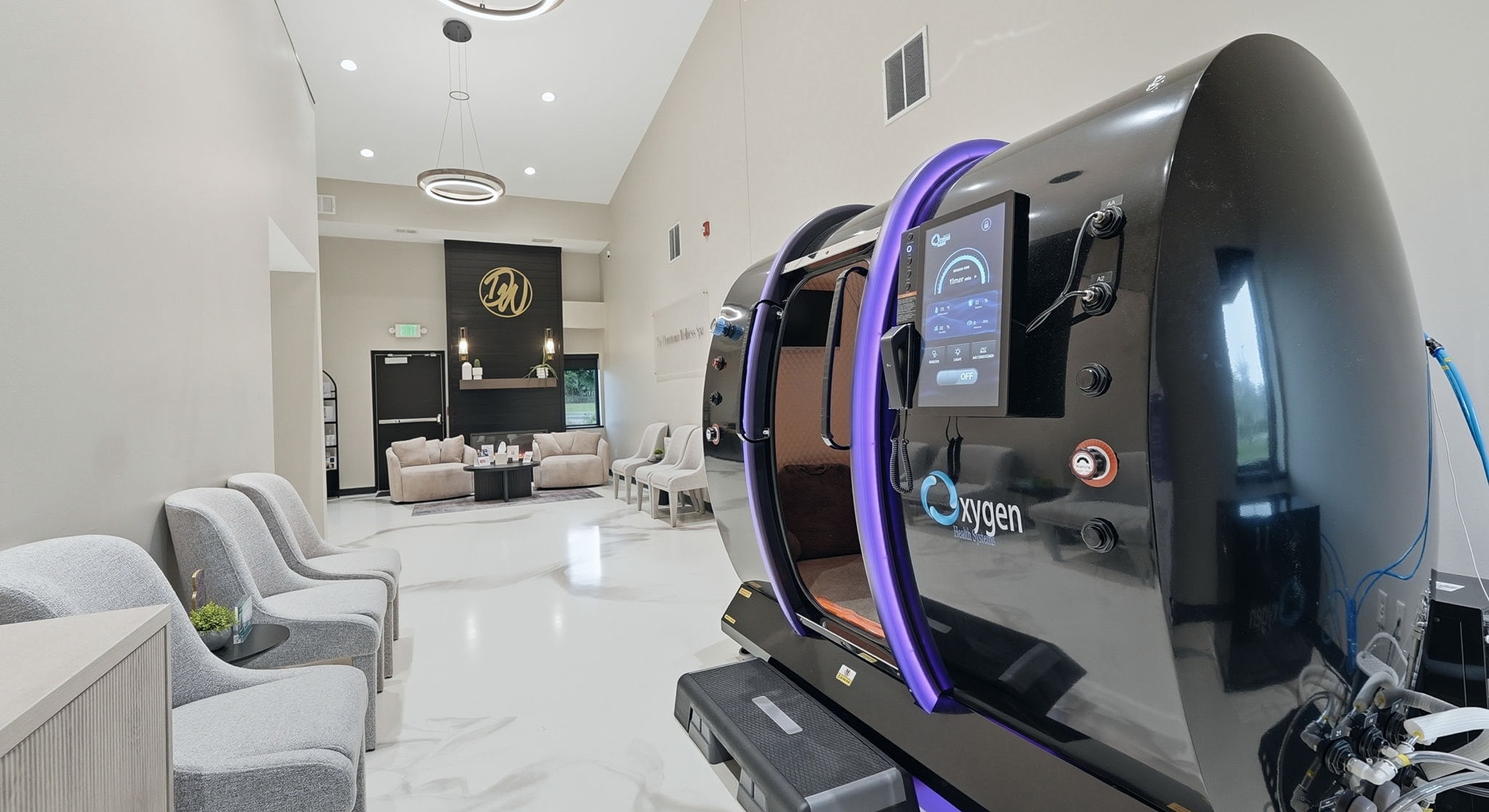 Hyperbaric chamber in modern therapy room setting.