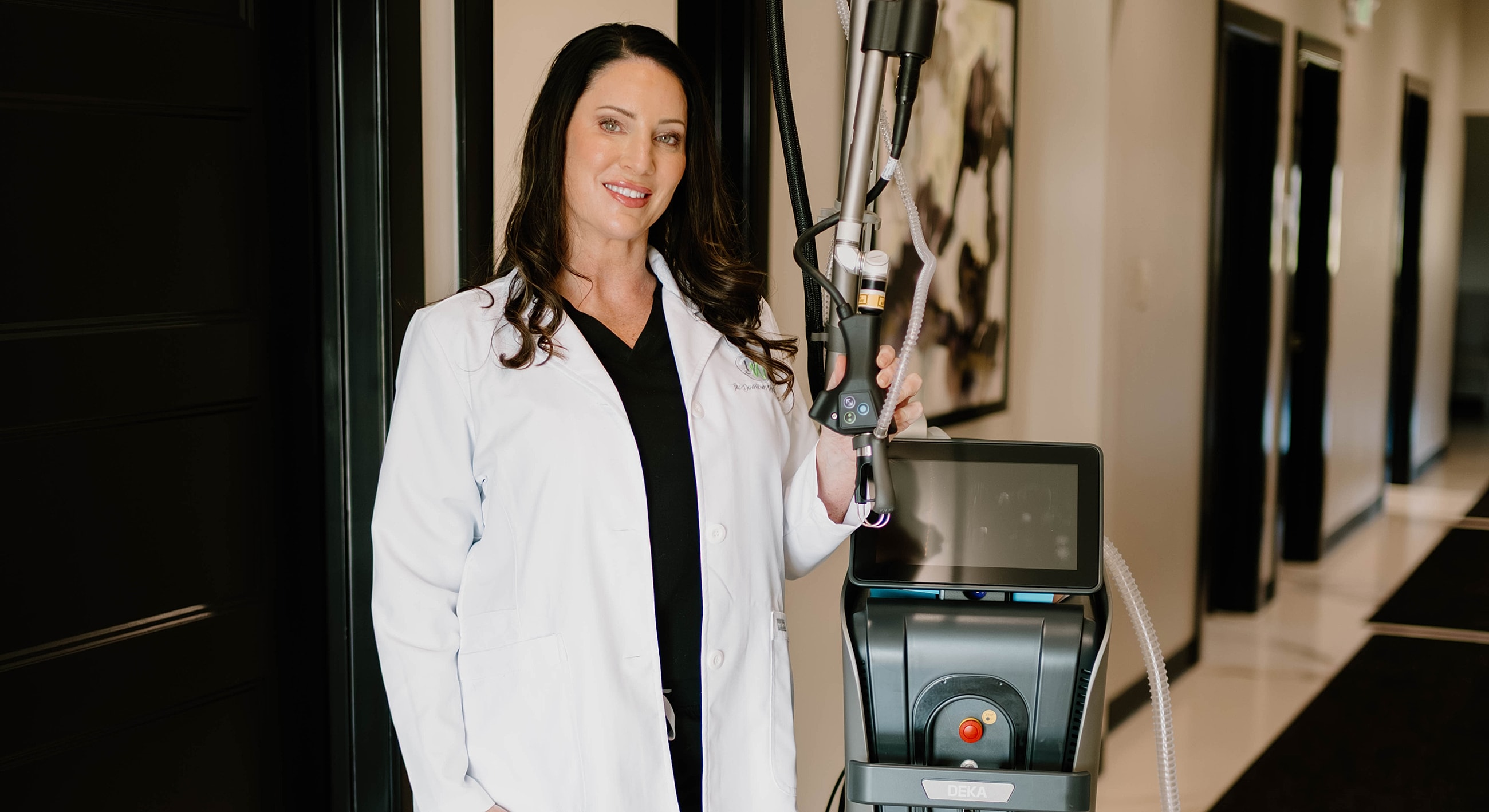Medical professional with laser treatment machine.