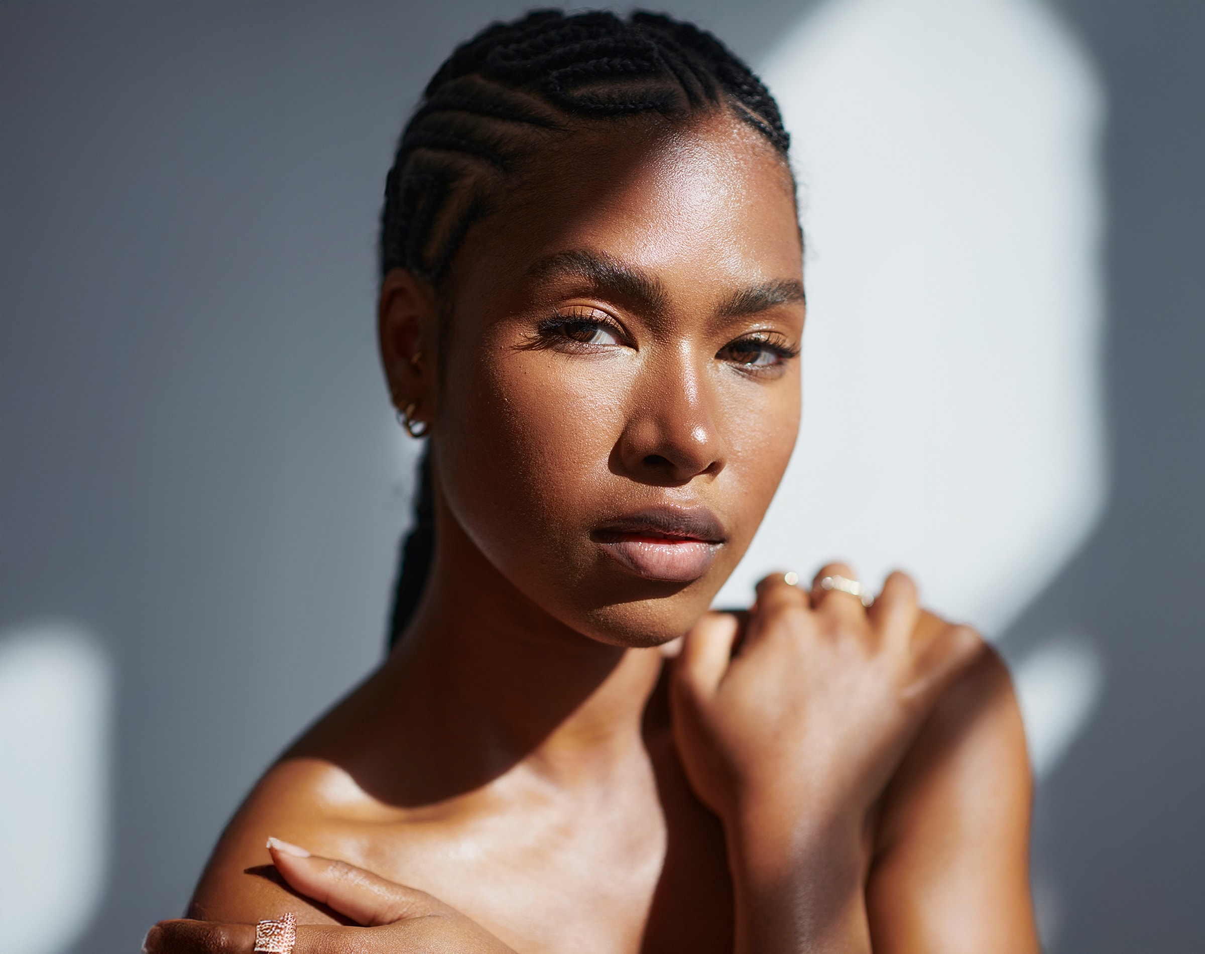 Portrait of a woman with braided hair.