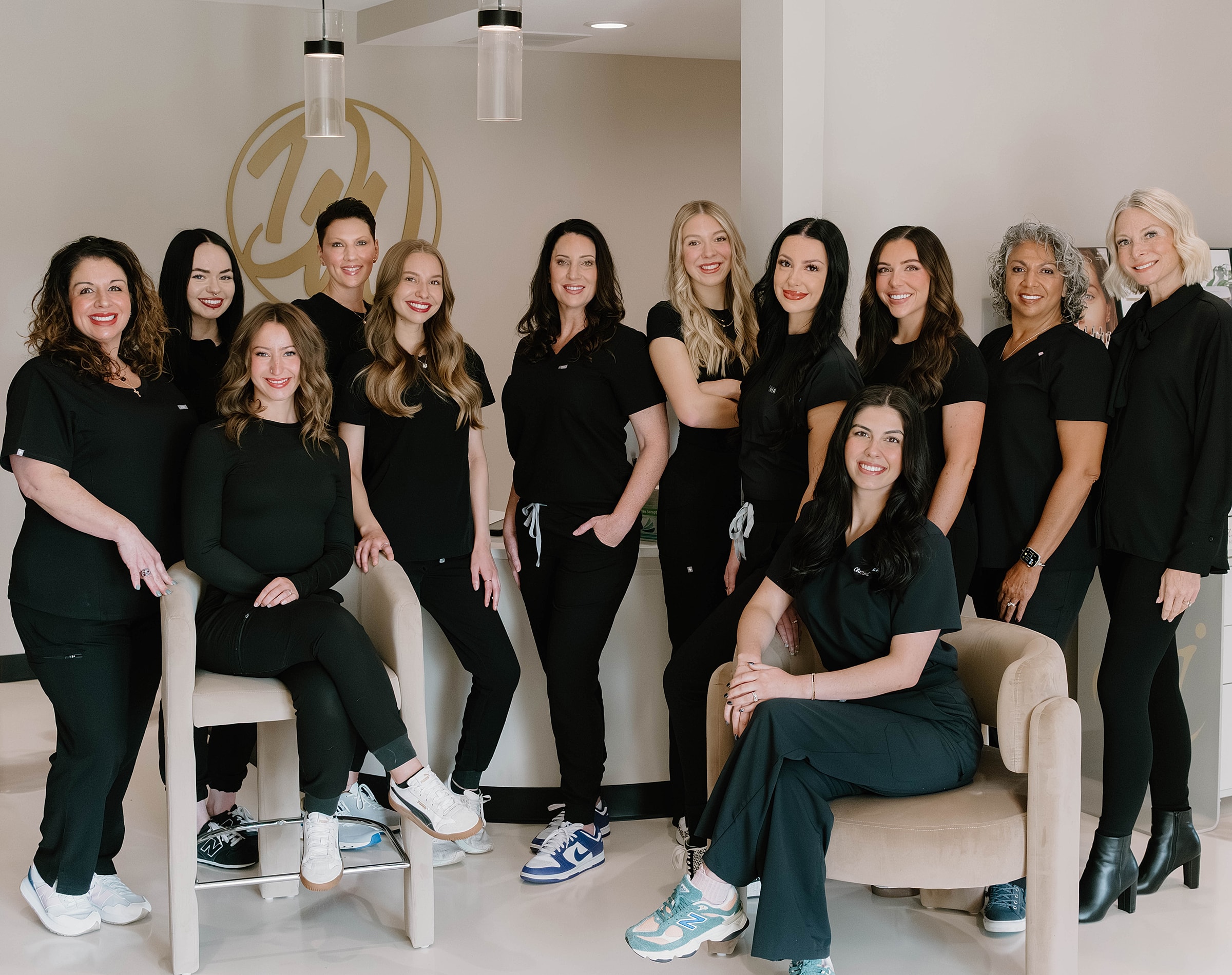 Dental team posing in professional attire.
