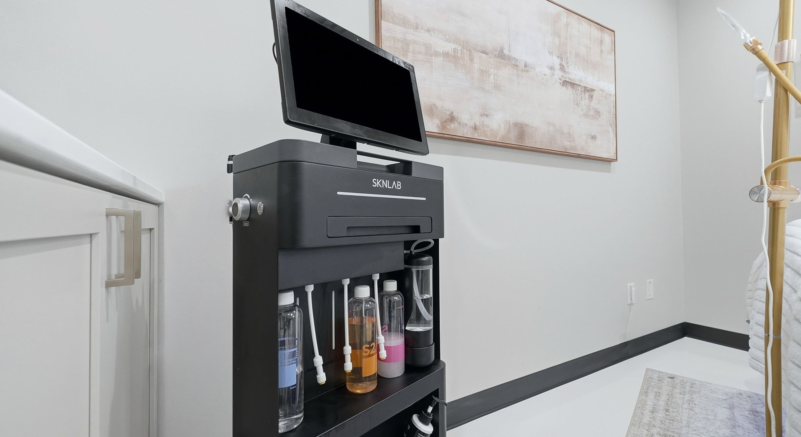 Skincare tool cart in modern treatment room.